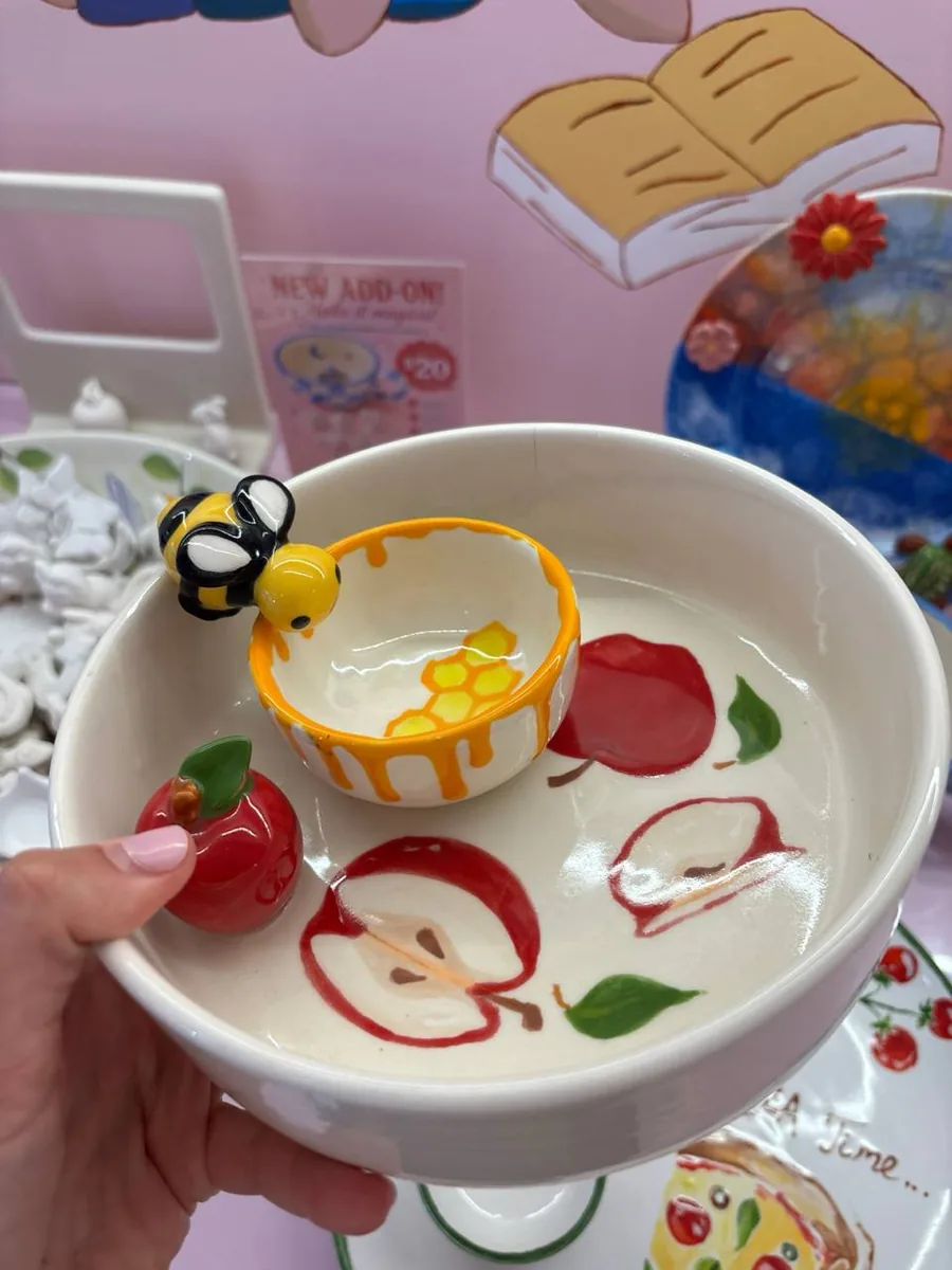Apple bowl with a bee